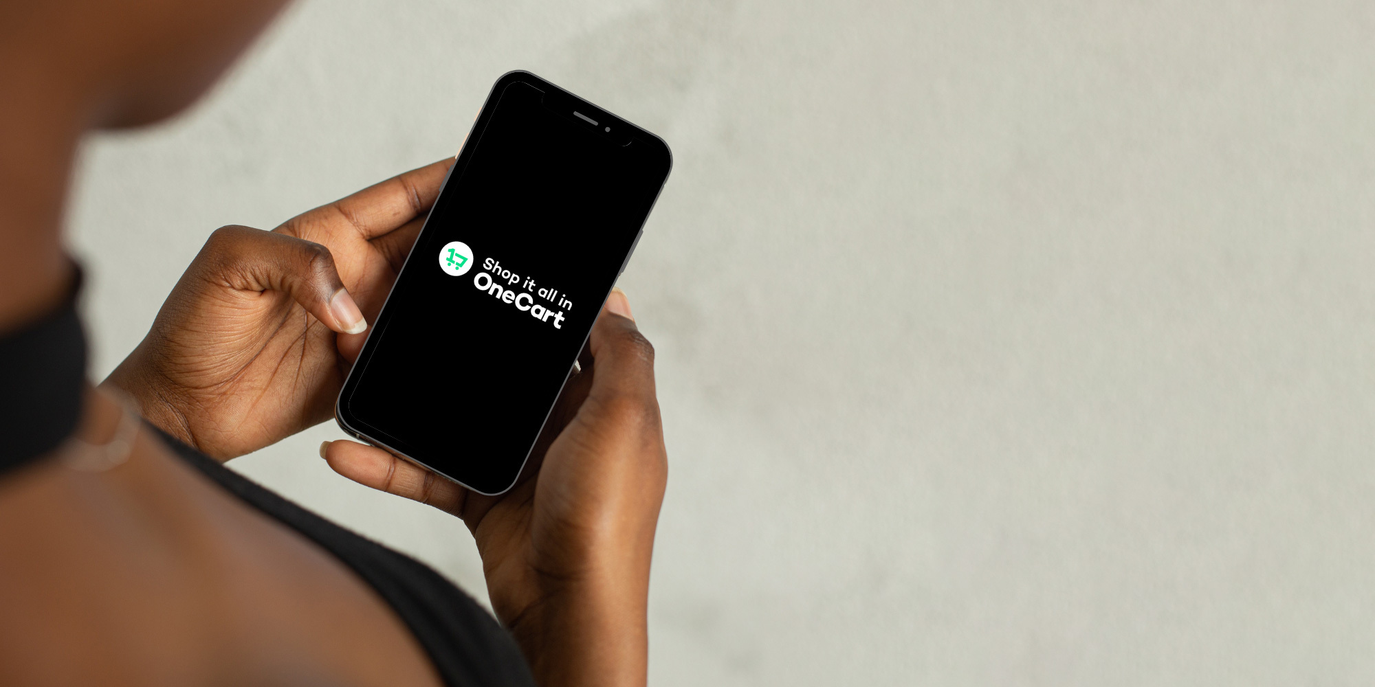 Holding mobile device using OneCart app