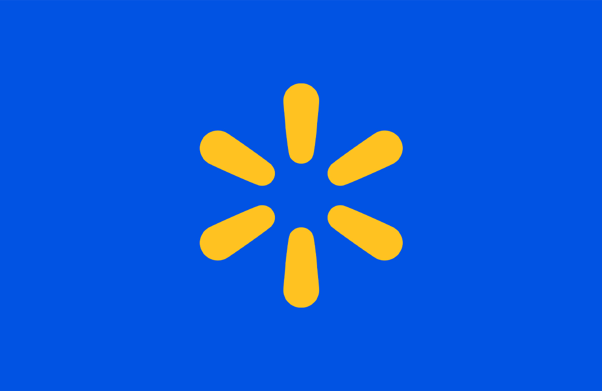Yellow Massmart icon is centered on a solid blue background. The design features six elongated teardrop shapes arranged in a circular pattern, creating a clean and modern symbol. The minimal composition emphasizes bold color contrast between the bright yellow graphic and the vivid blue field. This image conveys a contemporary, friendly, and approachable visual style suitable for digital interfaces or signage.