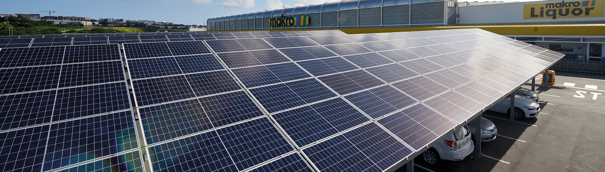 Rows of solar panels creating energy on a sunny day