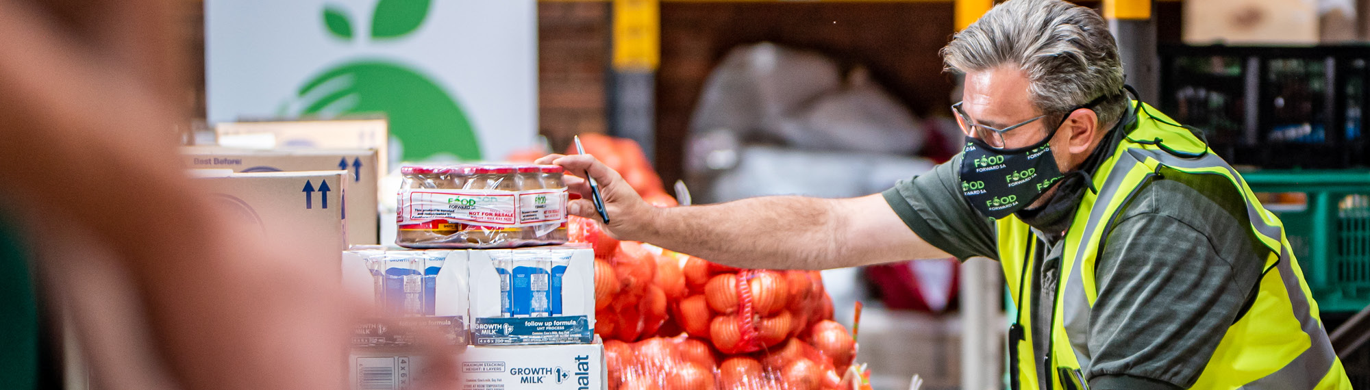 A safety worker inspects produce